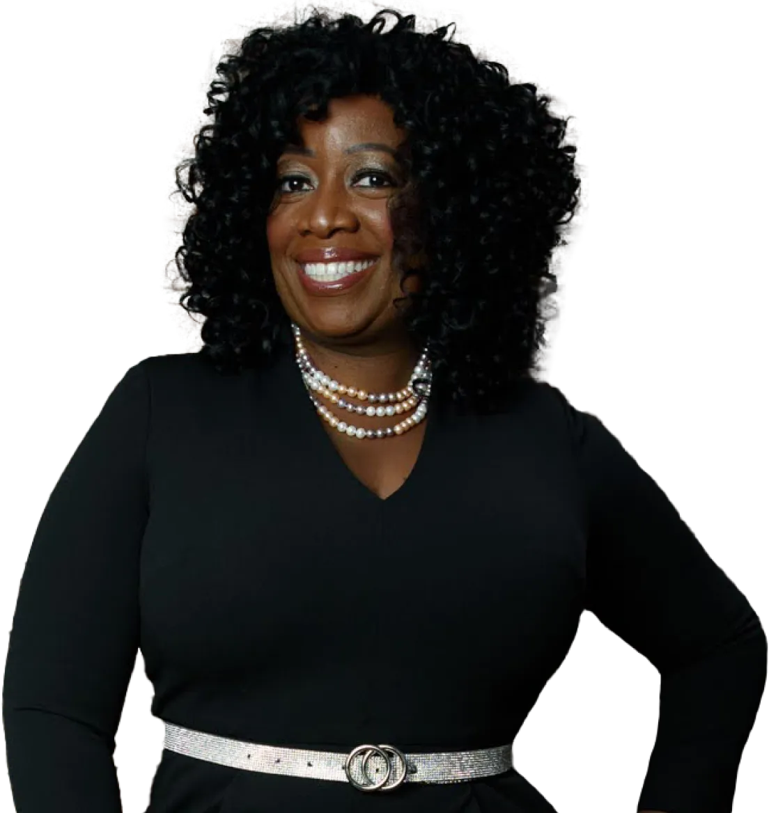 A woman with curly hair wearing black and white.